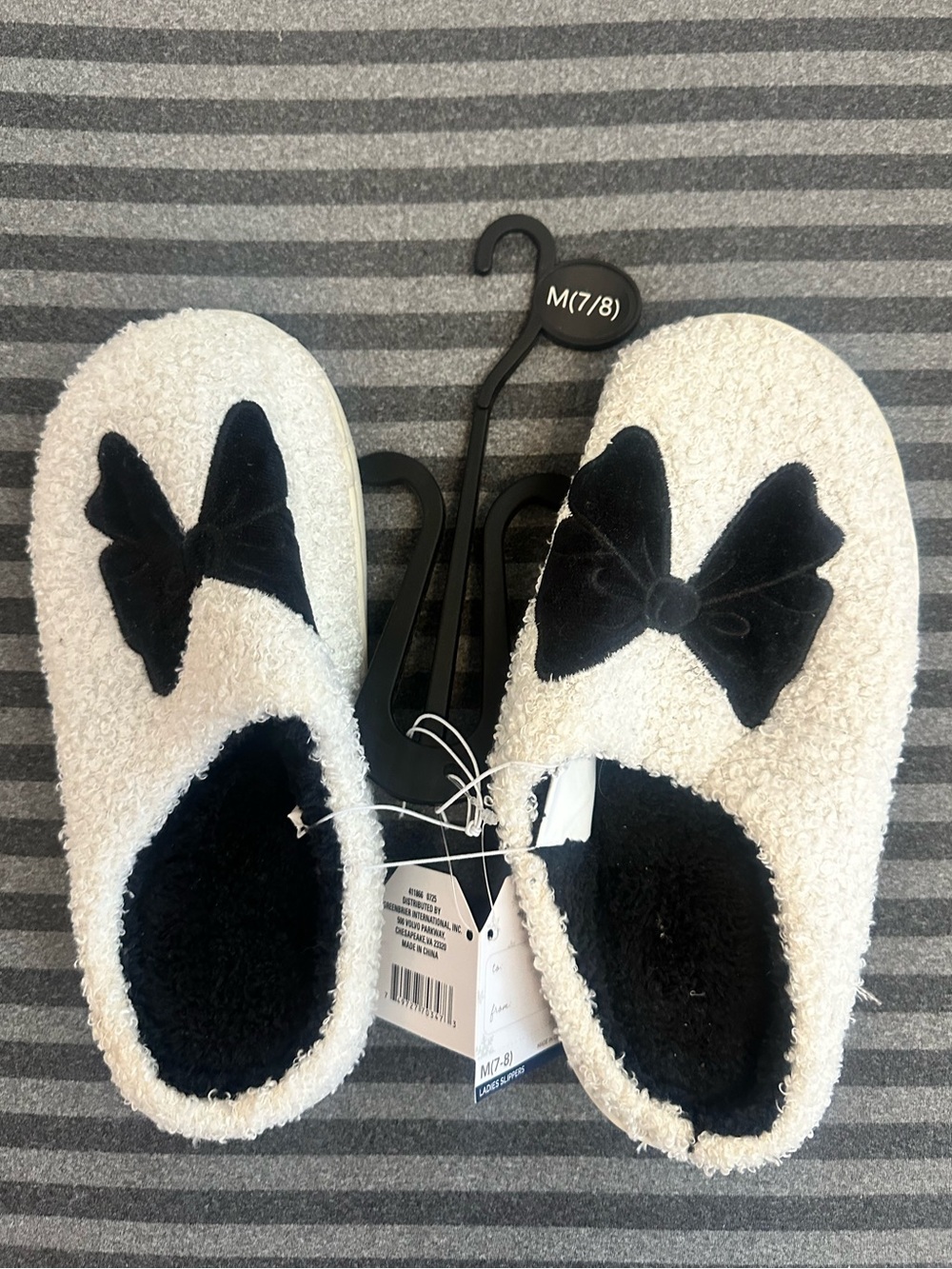 White Fuzzy Slip-On Slippers with Black Bow